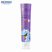 Orange ABL kids toothpaste tube with doctor cap