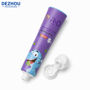 Orange ABL kids toothpaste tube with doctor cap